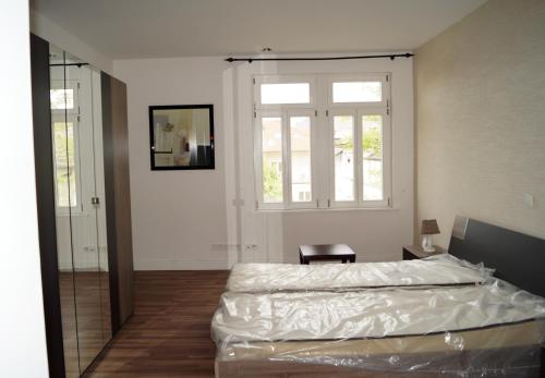 Katil atau katil-katil dalam bilik di Butzbach Hotel & apartment