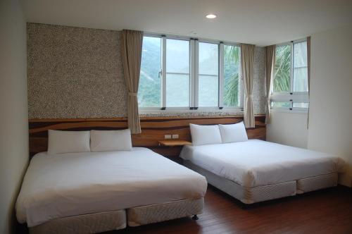 Chihpen Lucky Hot Spring B&Bにあるベッド