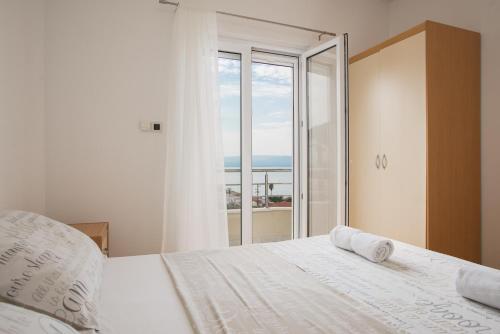 Un pat sau paturi într-o cameră la Apartment Toma
