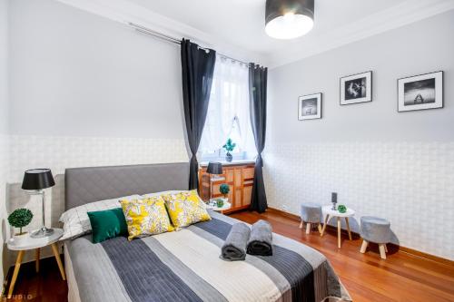 a bedroom with a bed and a window at *ClickTheFlat* Wilcza 33 Street Apart Rooms in the City Center in Warsaw