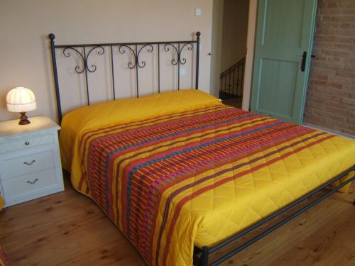Cama ou camas em um quarto em Agriturismo I Ciliegi del Checco