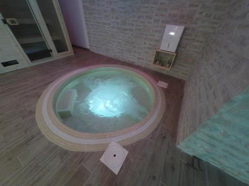 an overhead view of a large tub in a bathroom at Villa NOAH - 4 bedrooms, 4 bathrooms, heated inside pool, jacuzzi, sauna, gym in Kornić