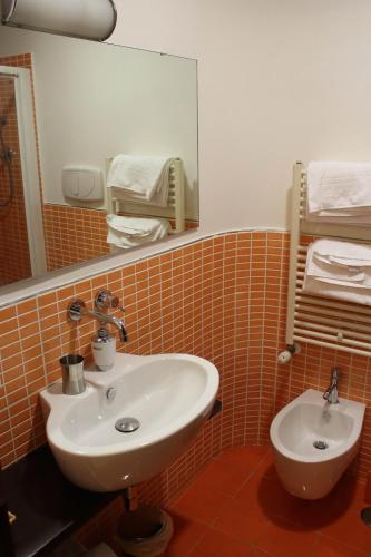 a bathroom with a sink and a mirror at Albergo Miramonti in Potenza