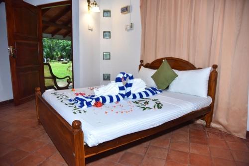 Cama o camas de una habitación en Royal Green Garden Hotel