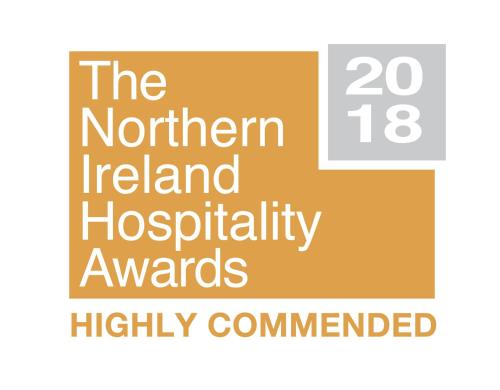 a sign with the words the northern ireland hospitaliabilityanguardhighly commended at Dewhamill in Bellaghy