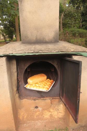 a open oven with some food inside of it at SALEM Eco-Lodge & Guesthouse in Mbale