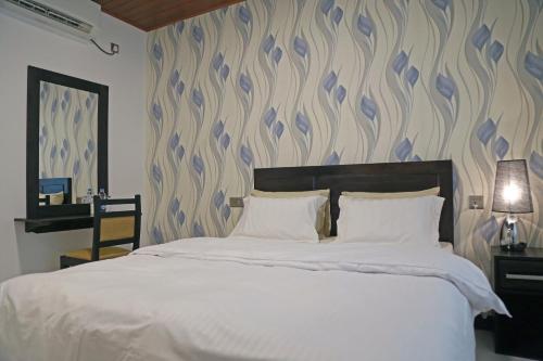 Ένα ή περισσότερα κρεβάτια σε δωμάτιο στο The Branch B&B