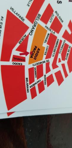a close up of a red and white sticker on a box at Hostal Asqui Pacha in Tilcara