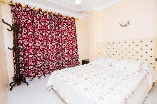 Giường trong phòng chung tại Appart Hotel Wassila