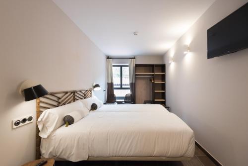 Postel nebo postele na pokoji v ubytování Hotel Rural Sagarlore