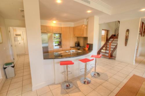 Kuchyň nebo kuchyňský kout v ubytování Paradise Links Resort Port Douglas