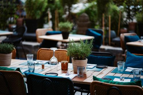 a table set up for a meal in a restaurant at Thehotel at LIPPISCHER HOF in Bad Salzuflen