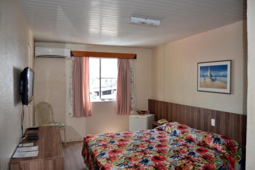 Кровать или кровати в номере Hotel Casa De Praia