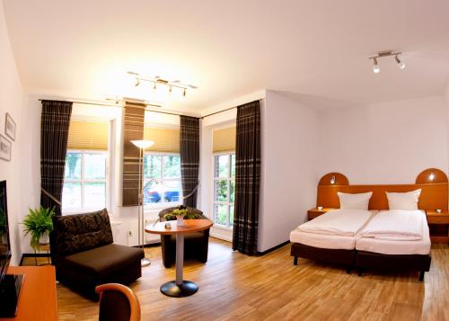 Postel nebo postele na pokoji v ubytování Hotel Waldquelle