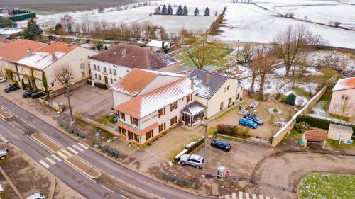 an aerial view of a large house with a street at LES JARDINS DE LA GRANGE in Rezonville