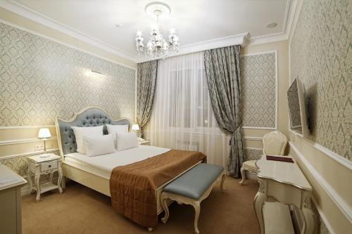 Ένα ή περισσότερα κρεβάτια σε δωμάτιο στο Hotel Ekaterina Kostroma