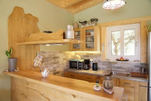 Η κουζίνα ή μικρή κουζίνα στο Driftwood Villa