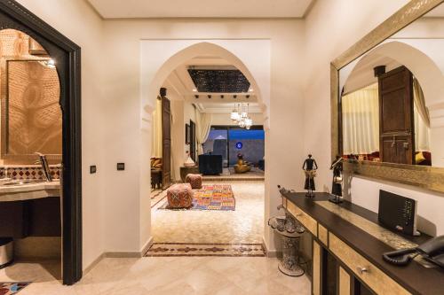 a bathroom with a sink and a mirror at VILLA ILYANA in Marrakesh