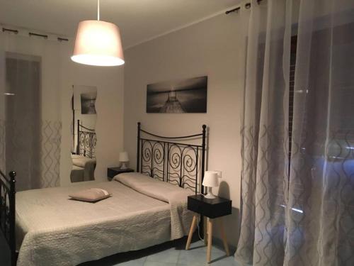 Una cama o camas en una habitación de Traiano Suite