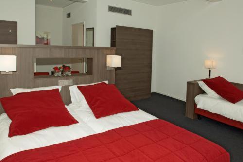 Een bed of bedden in een kamer bij Hotel Bonaventure