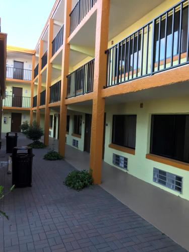 an empty courtyard of an apartment building at Days Inn by Wyndham N Orlando/Casselberry in Orlando