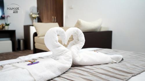 Postel nebo postele na pokoji v ubytování Hotel Írisz