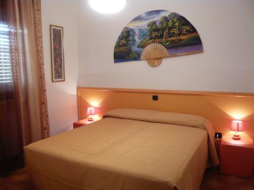 Postel nebo postele na pokoji v ubytování Appartamenti Falco