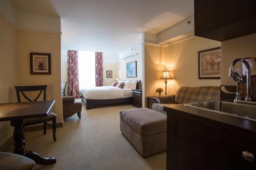 Ένα ή περισσότερα κρεβάτια σε δωμάτιο στο Hotel Vallea Bromont