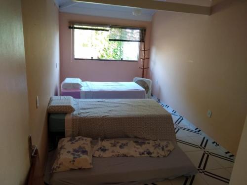 Säng eller sängar i ett rum på Apartamento Cumuru
