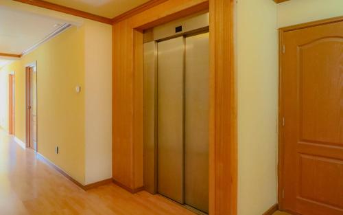 a room with a door open and a door open at Hotel Saltos del Paine in Puerto Natales