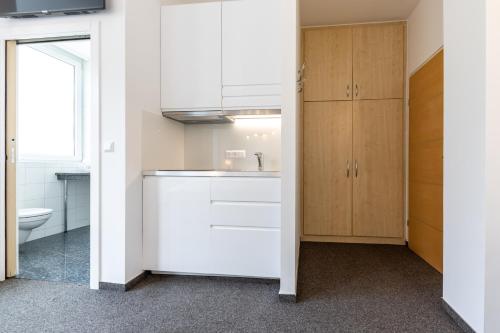 Kuchyň nebo kuchyňský kout v ubytování Vienna Cube Apartments Contactless Check IN