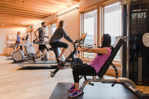 a group of people riding bikes in a gym at Headlands Coastal Lodge & Spa in Pacific City