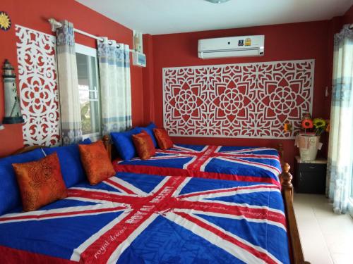 Cama ou camas em um quarto em One-D Homestay