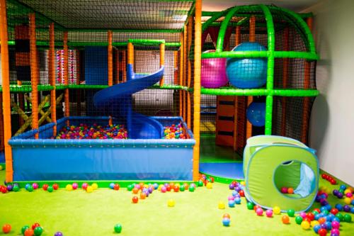 a childrens play room with a toy playground at Hotel Antoni in Tomaszów Lubelski