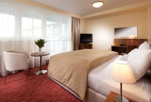 Ένα ή περισσότερα κρεβάτια σε δωμάτιο στο Clarion Congress Hotel Ostrava