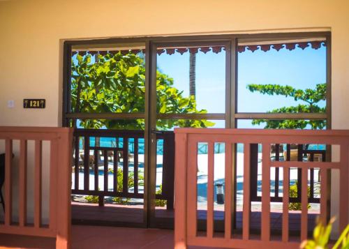 a view of the beach from the balcony of a house at VRclub Paje Palms Beach Resort in Paje