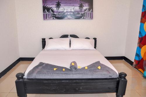 Katil atau katil-katil dalam bilik di Papaya Guest House Nungwi