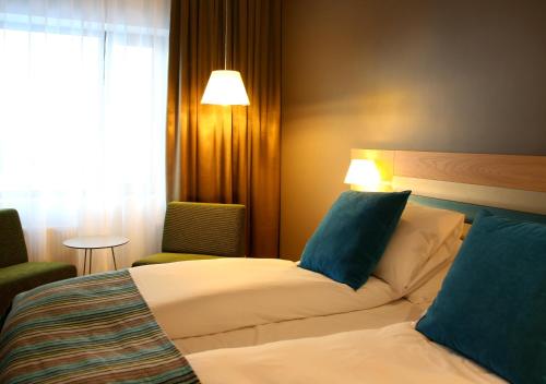 Postel nebo postele na pokoji v ubytování Thon Hotel Brønnøysund