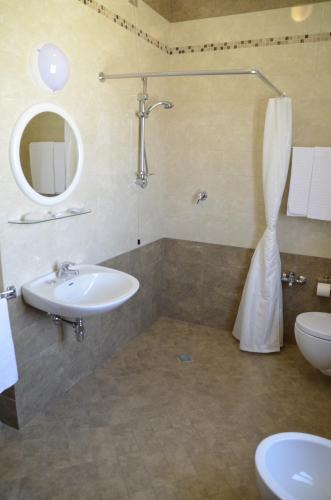 a bathroom with a sink and a toilet at Hotel Del Buono Wellness & Medical Spa in Chianciano Terme