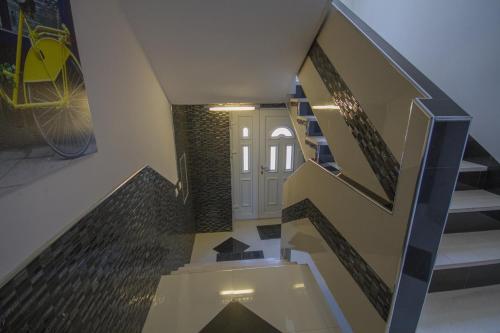 a staircase in a house with a glass floor at Apartmani Milena in Herceg-Novi