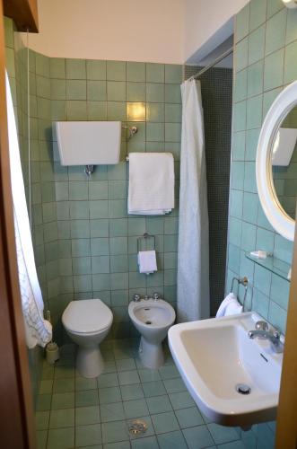 a bathroom with a toilet and a sink at Hotel Del Buono Wellness & Medical Spa in Chianciano Terme