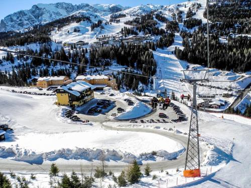 a ski resort with a ski lift in the snow at Apartments Bergblick in Sonnenalpe Nassfeld