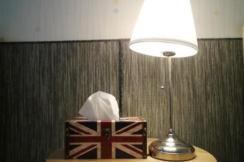 a gift box sitting on a table next to a lamp at Mr. Kim Guesthouse in Incheon