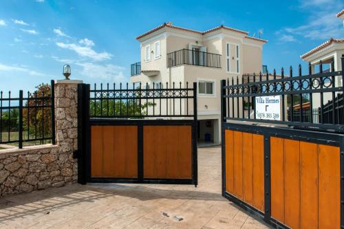 a gate in front of a house at Villa Hermes in Porto Heli