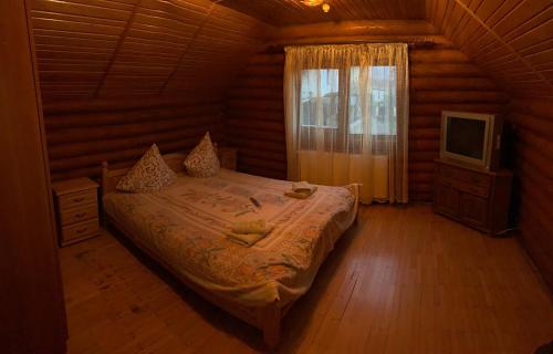 A bed or beds in a room at Рутенія