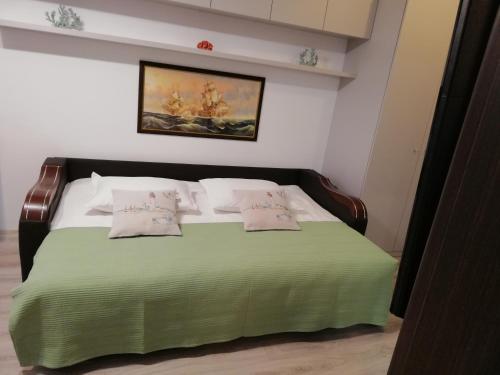 מיטה או מיטות בחדר ב-Kolonaki Domus Apartment