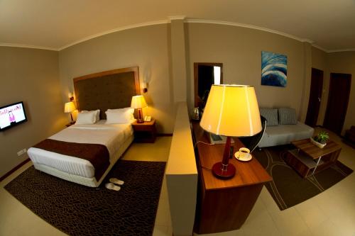 Ένα ή περισσότερα κρεβάτια σε δωμάτιο στο Seascape Hotel