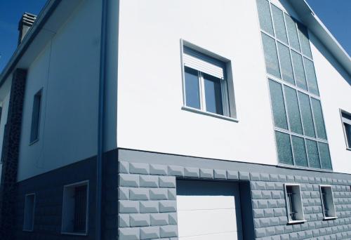 a white building with windows on the side of it at Cà Fernanda in Fiesso Umbertiano