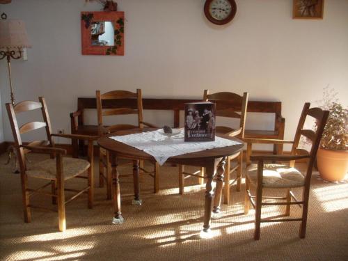 a table and chairs with a book on top of it at Chambres d'hôtes Domaine de Beaupré in Narbonne