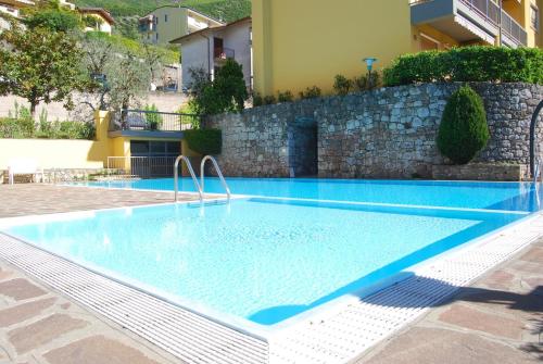 a swimming pool in the middle of a building at Casa Angelo in Malcesine